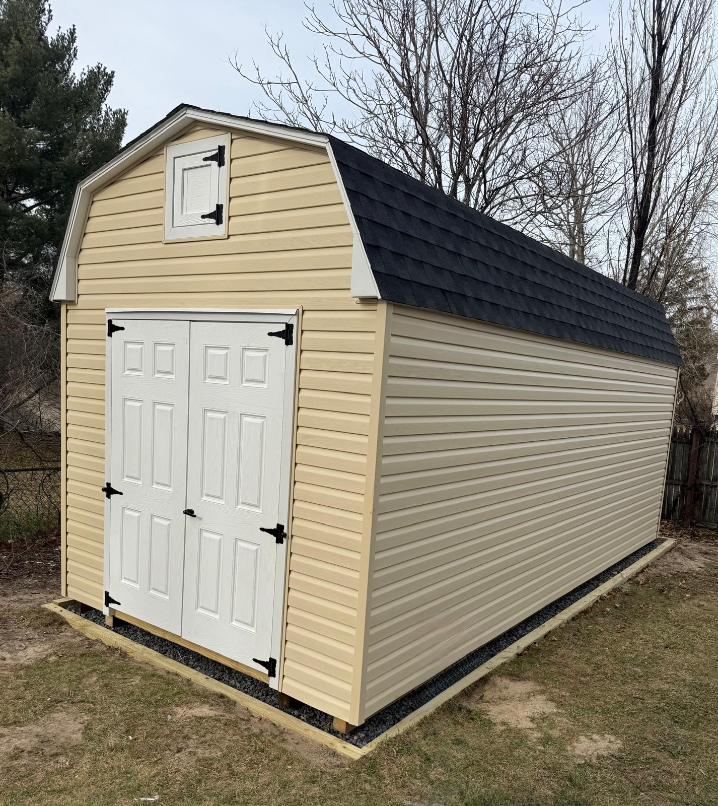 Beige Vinyl Barn with White Doors